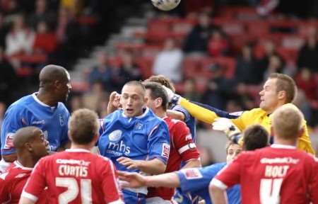 Gillingham players go close from a corner kick but are thwarted by keeper Paul Smith. Picture: MATT READING