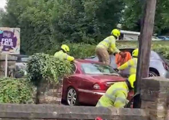 Emergency services tried to tip the car back onto four wheels