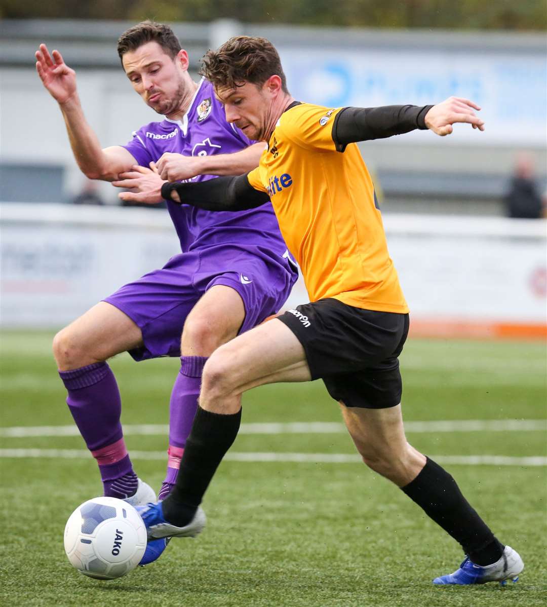 Dartford's Luke Allen and Maidstone's Matt McClure do battle in Saturday's FA Trophy draw at the Gallagher Picture: Matthew Walker