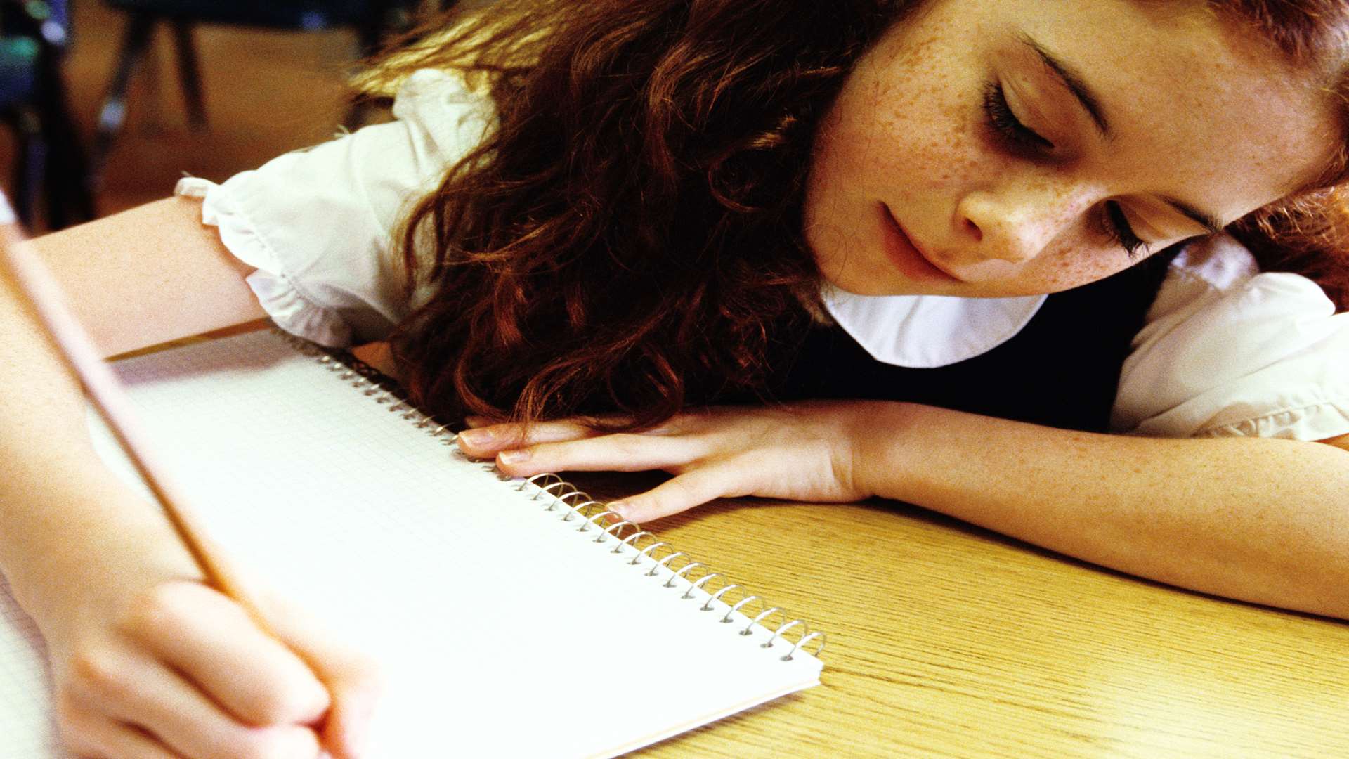 Girl sitting exam. Stock image.