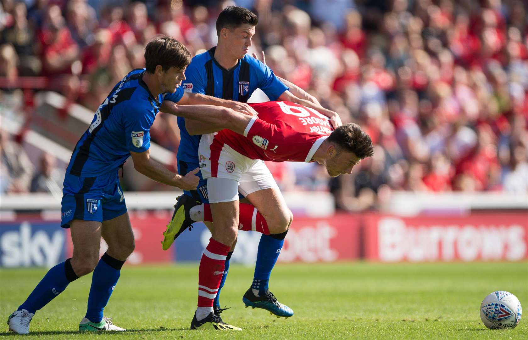 Gillingham's Billy Bingham and Callum Reilly battle against two-goal Keiffer Moore. Picture: Ady Kerry