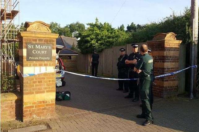 Police set up a cordon at St Mary's Court in Station Road