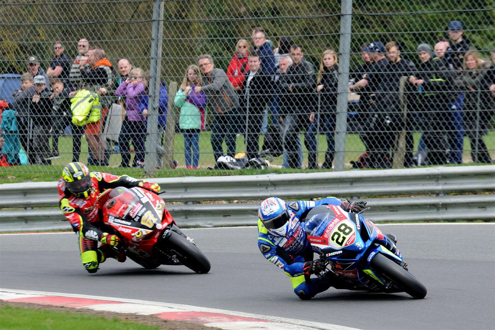 Shane Byrne chases Lydd's Bradley Ray Picture: Simon Hildrew