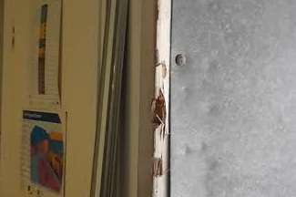 The damaged door at Kent Fresh Foods, High Street, Sheerness