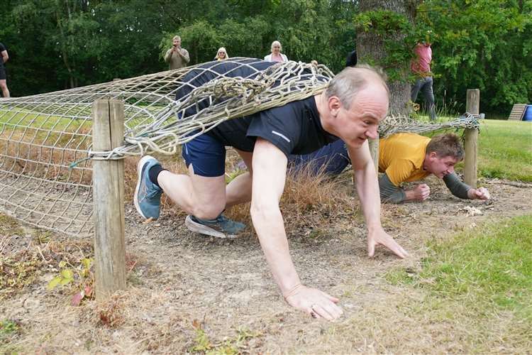 Sir Ed Davey at an assault course on the campaign trail in Kent on Thursday (Gareth Fuller/PA)