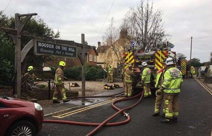 Firefighters at the scene in November 2016 when the Hooden on the Hill was gutted by the fire