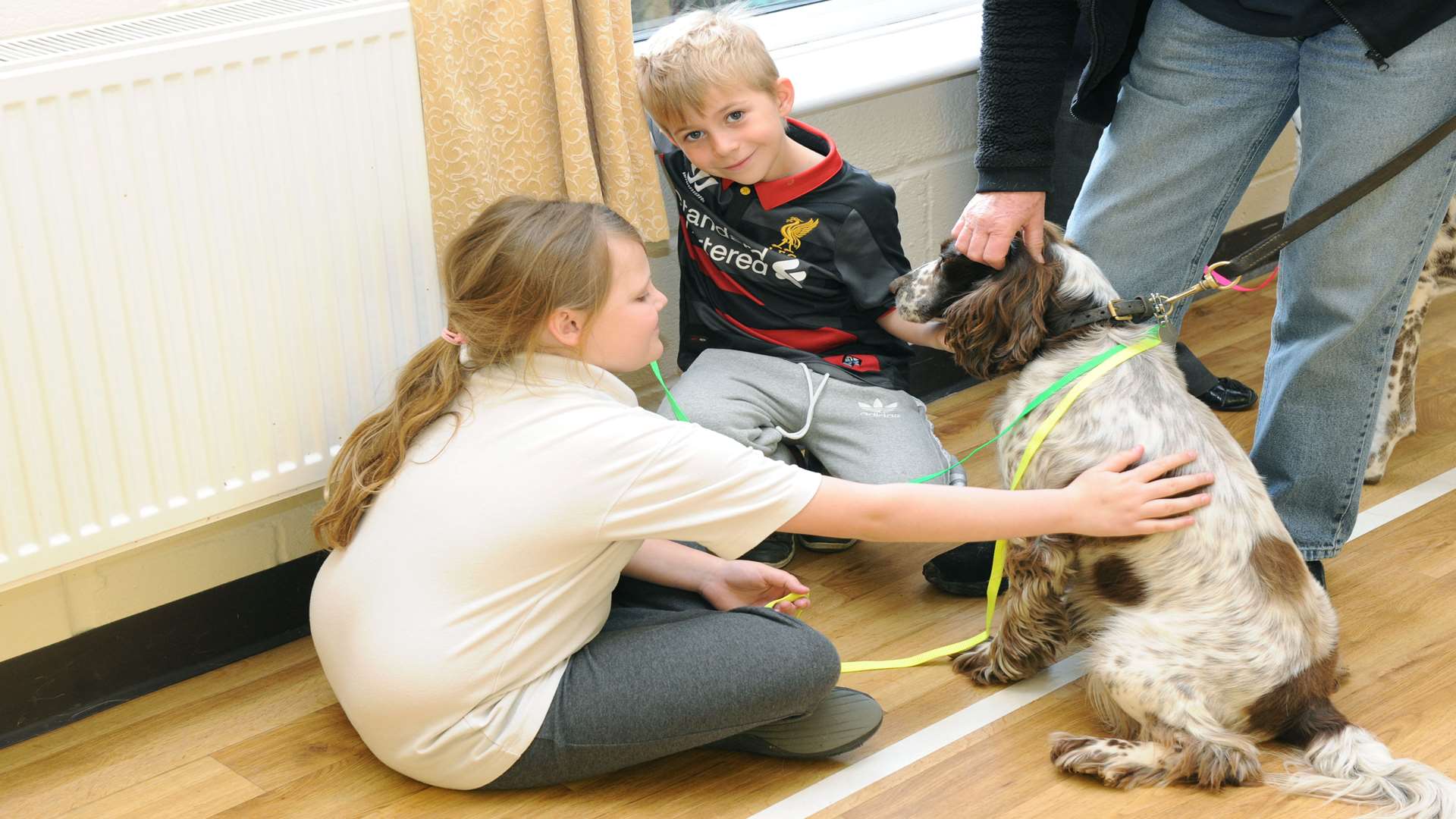 Rachel Zigler, 9, and Logan Tandy, 6, meet Hooch the spaniel. Picture: Simon Hildrew