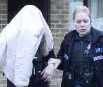 A woman suspect is arrested. Picture: PAUL DENNIS