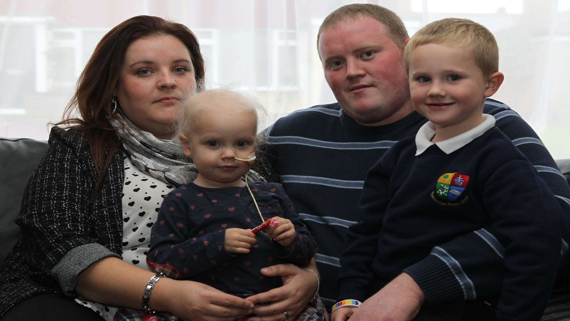 Ruby Young with parents Vikki and Rob and brother, Freddy, five