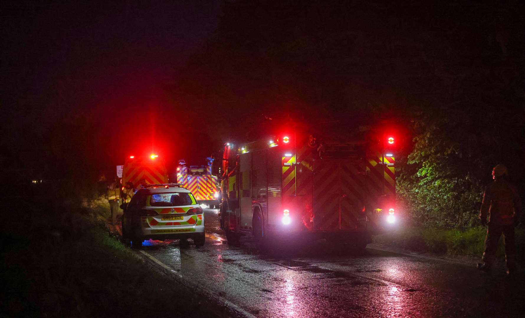 Crews cut away at the roof of the car to free a person. Picture: UKNIP