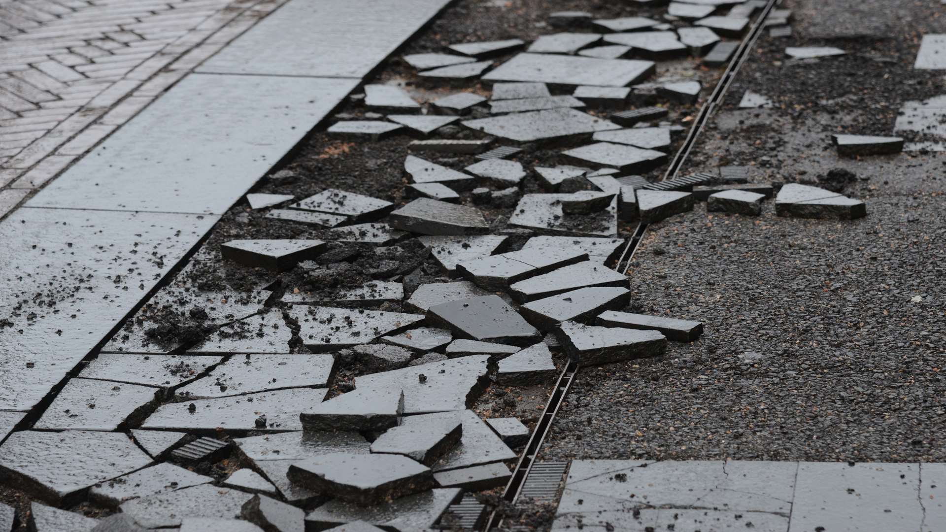 Damaged paving at the bottom of Bank Street