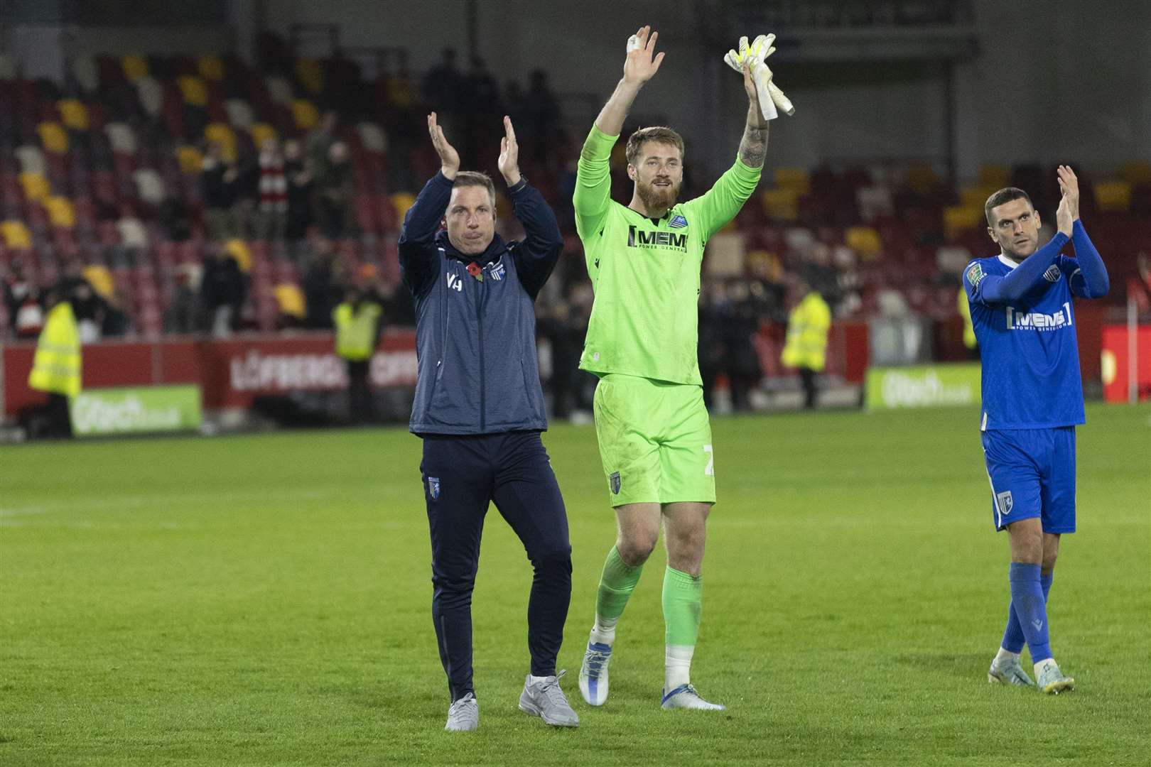 Manager Neil Harris, goalkeeper Jake Turner and captain Stuart O'Keefe thank the Gillingham fans. Picture: KPI