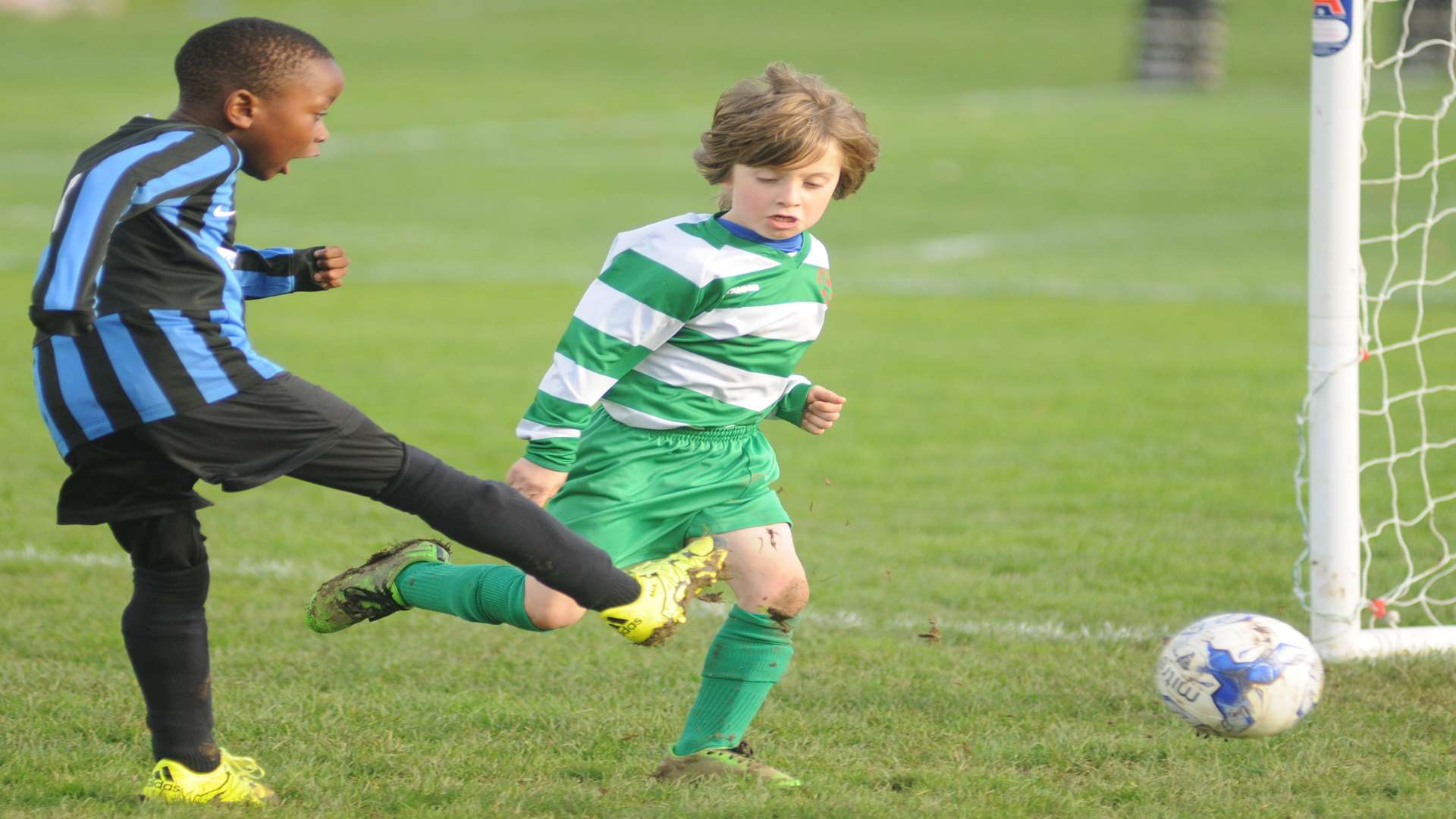 Omega 92 under-7s go for goal against New Ash Green under-7s. Picture: Steve Crispe