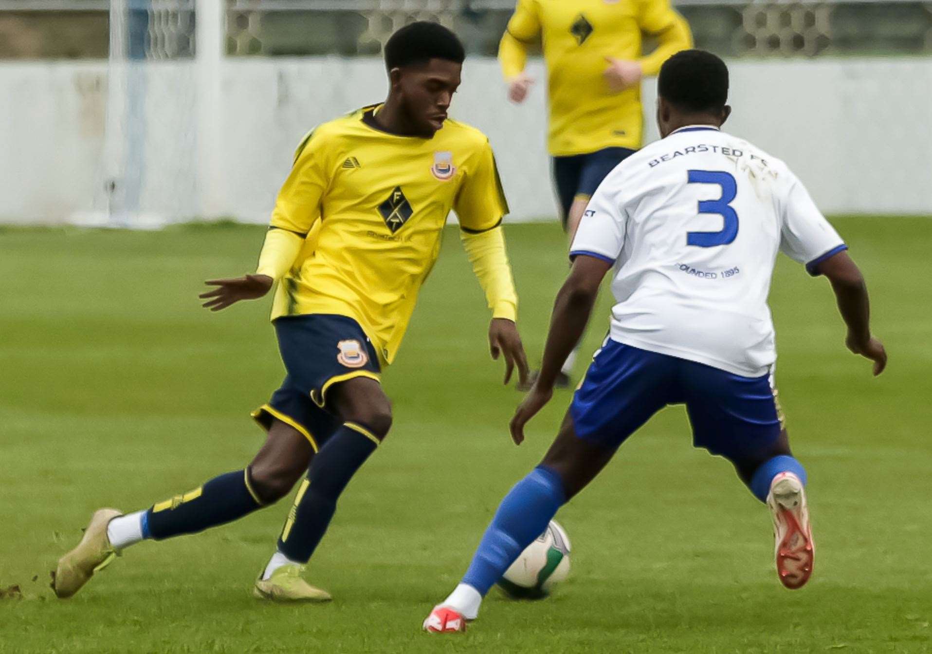 Whitstable’s Tyler Anderson takes on home defender Dennis Agbodume. Picture: Les Biggs