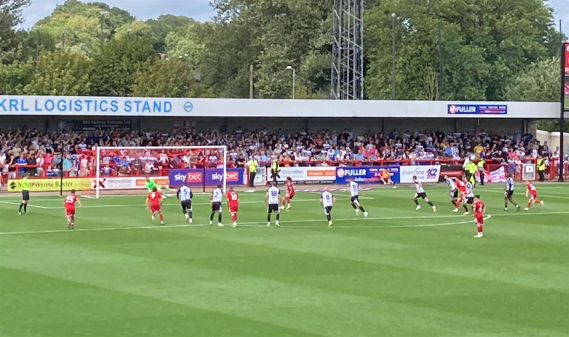 Gillingham keeper Jake Turner saves Dom Telford's penalty at Crawley