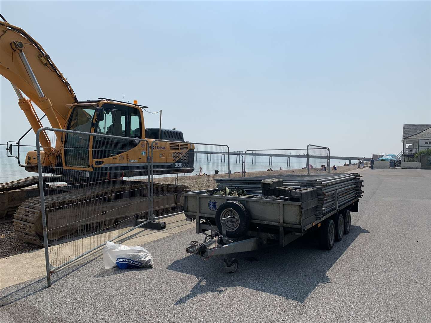 A digger parked close to The Royal Hotel on Deal beach