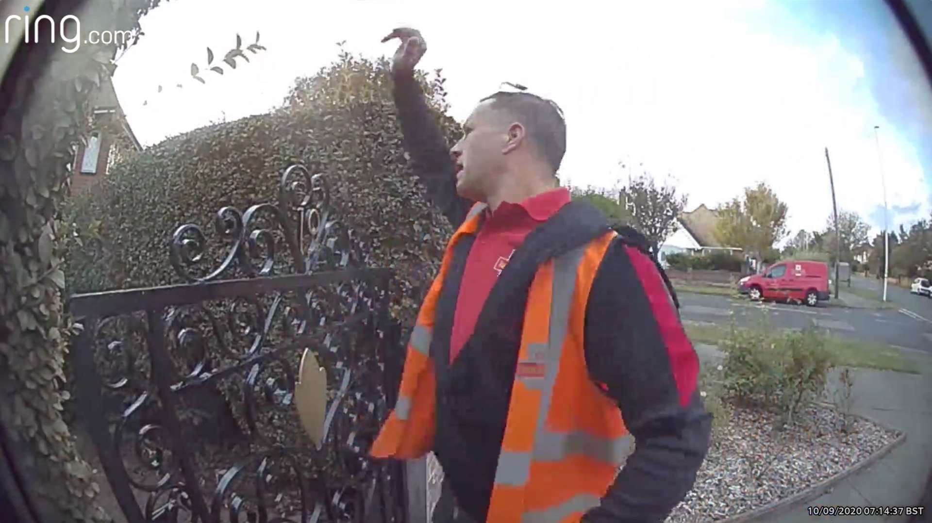 The postie lobbing the parcel over the gate