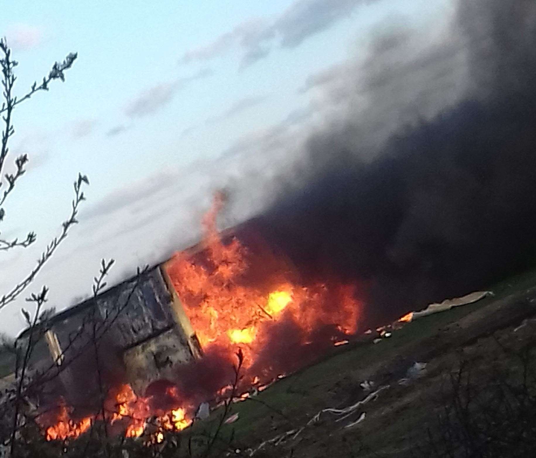 The van in flames. Pictures: Cameron Taylor