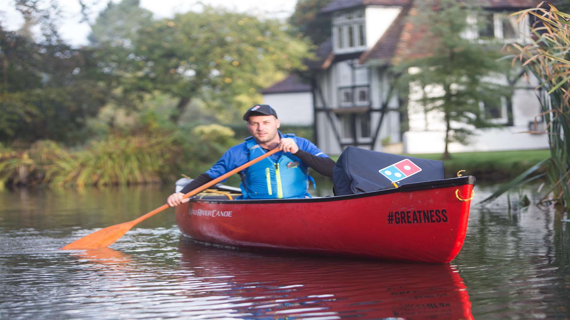 Can-oe believe it? Pizza being delivered by boat. Picture: Domino's Pizza