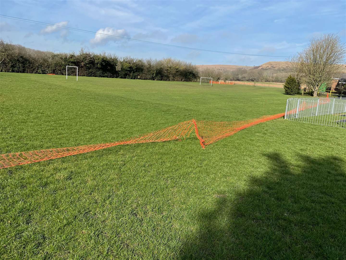 Stagnant water has been left in a field near Newington village hall. Residents worry it is sewage. Picture: Geoff Arnold