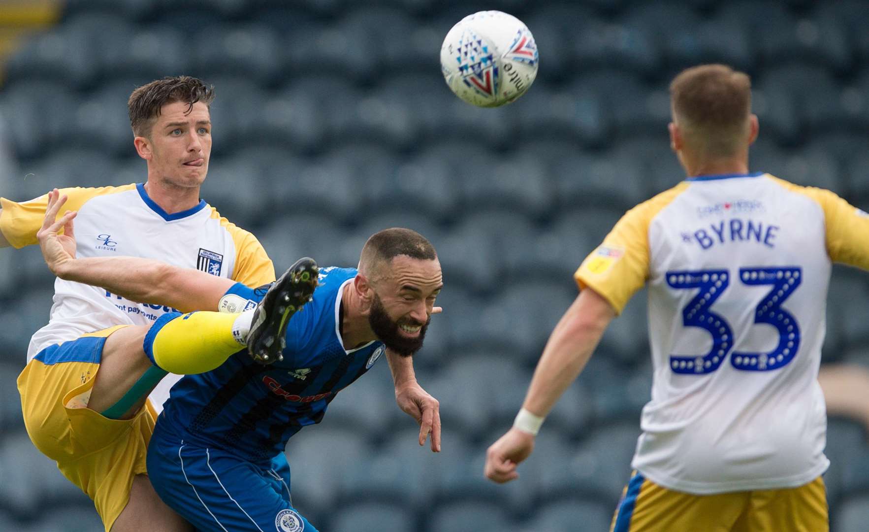 Alex Lacey clears his lines from Rochdale's Aaron Wilbraham Picture: Ady Kerry