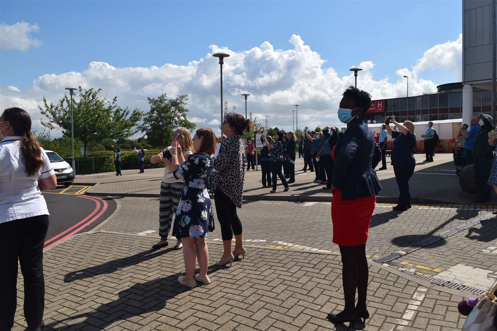 Crowds cheered on the spitfire as it flew over Darent Valley Hospital in Dartford last month