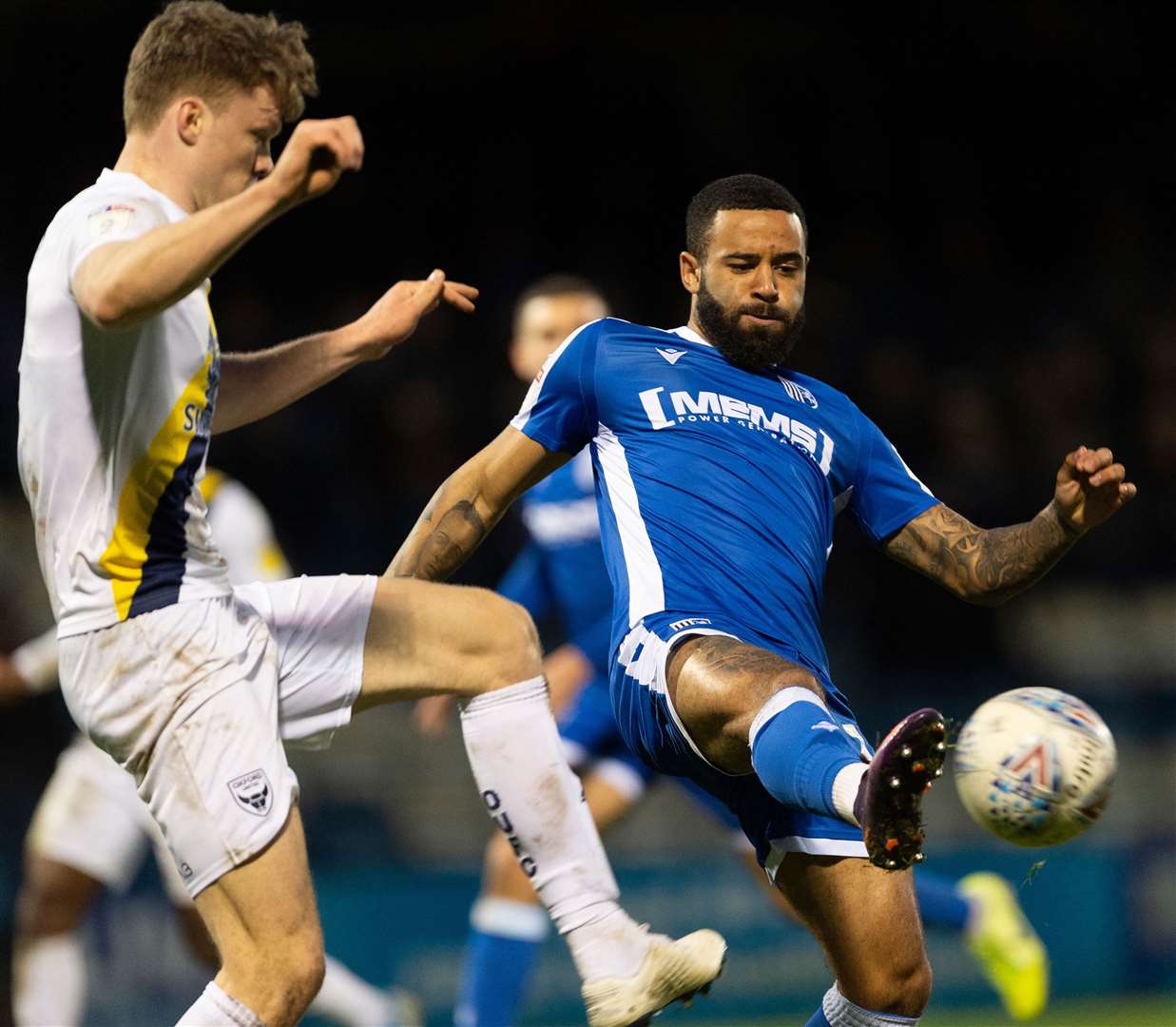 Alex Jakubiak gets to the ball before Oxford's Rob Dickie Picture: Ady Kerry