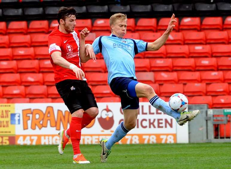 Jim Stevenson wins this challenge at Sincil Bank Picture: John Pakey