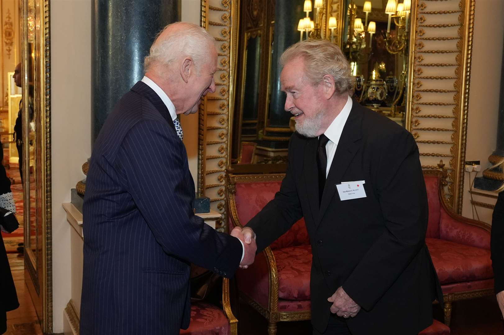 The King with Sir Ridley Scott during a reception to mark the centenary of the Film and TV charity, at Buckingham Palace, London (Aaron Chown/PA)