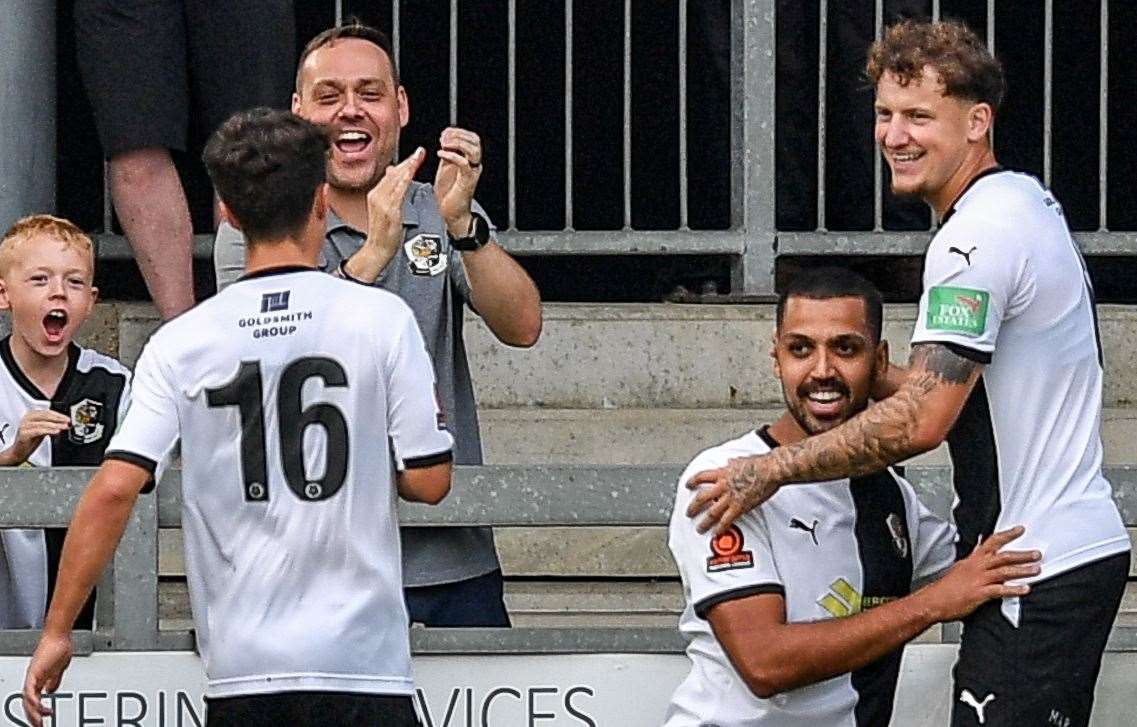 Two-goal Lewis Manor is congratulated by team-mates Baris Altintop and Archie Woods. Picture: Dave Budden