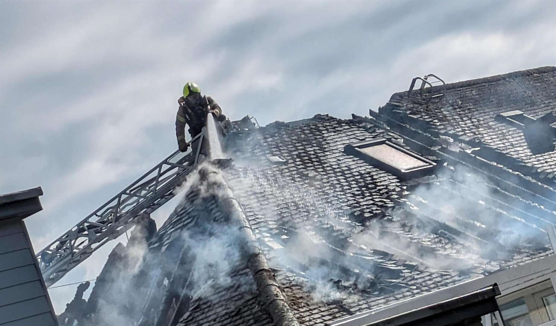 Firefighters dousing the flames