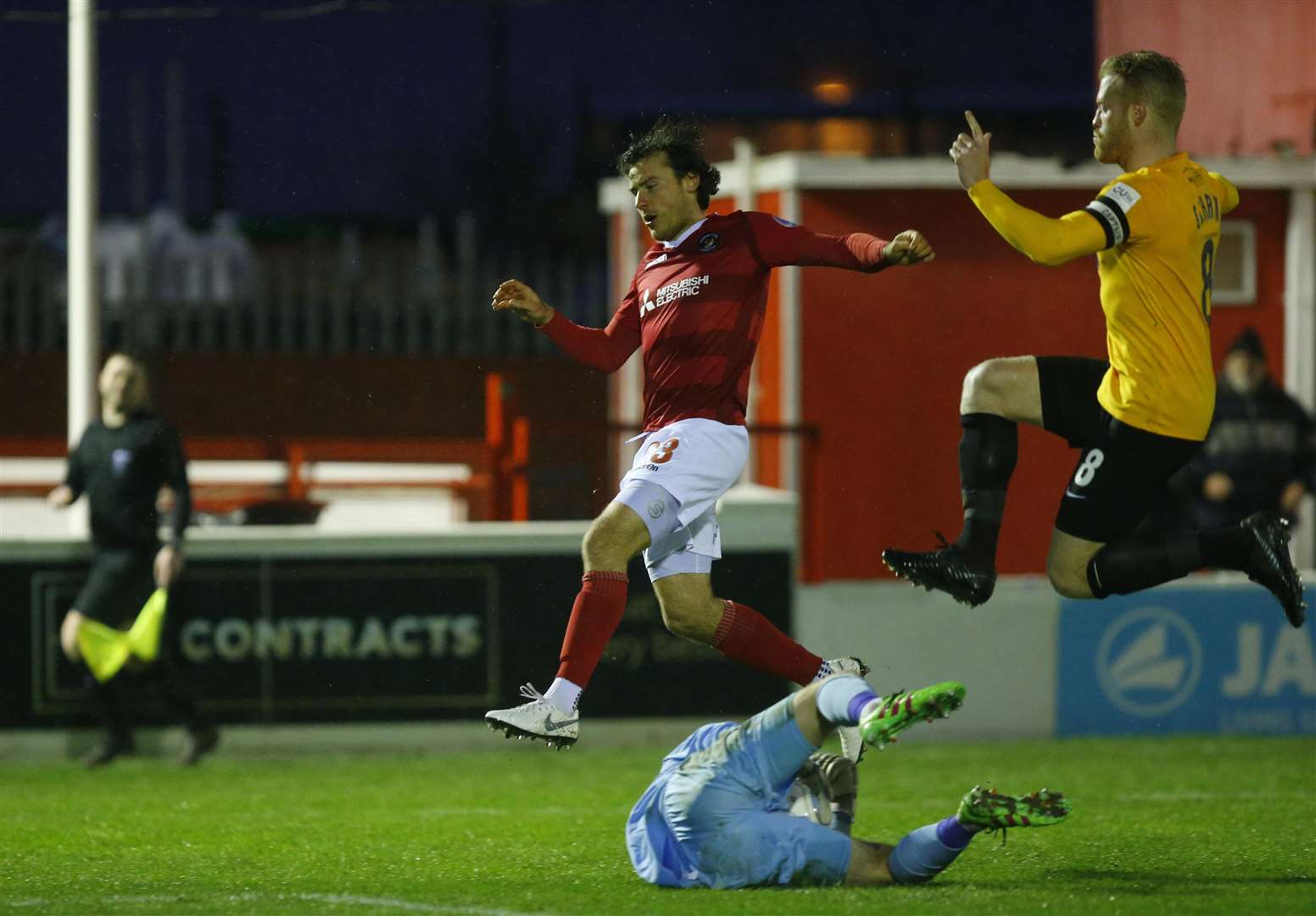 Lawrie Wilson is denied by Lewis Moore as Kenny Clark gives chase Picture: Andy Jones