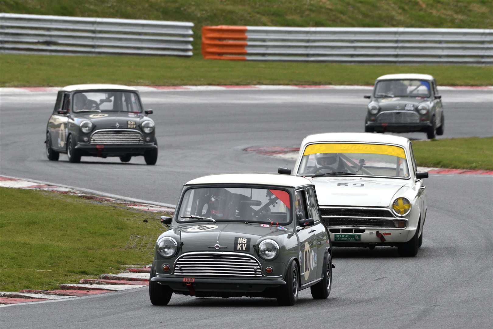 Sollis leads the Historic Touring Car pack through McLaren