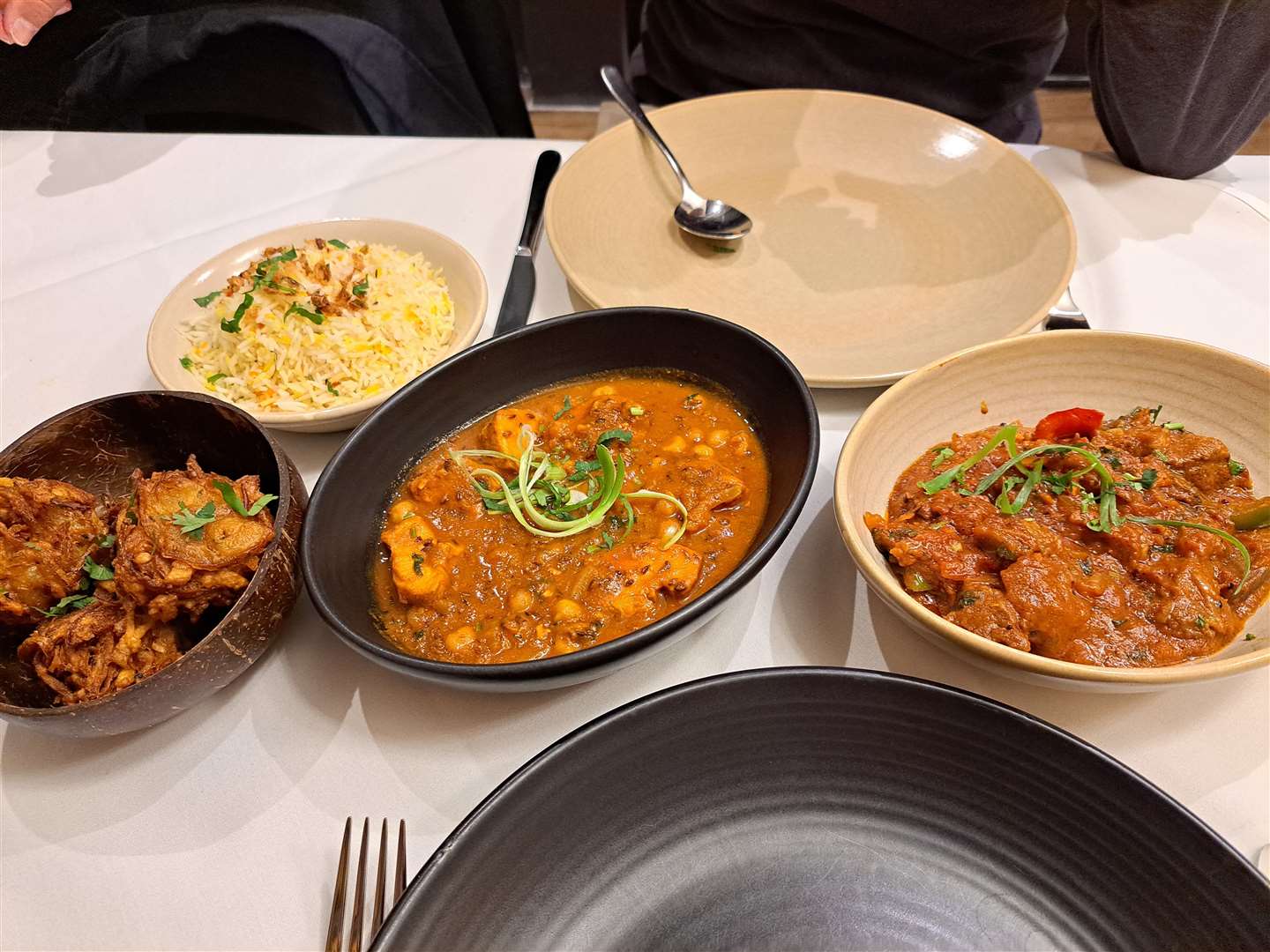 The main event. From left: onion bhaji, pilau rice, Zeera chicken and Shaktora Ghoast