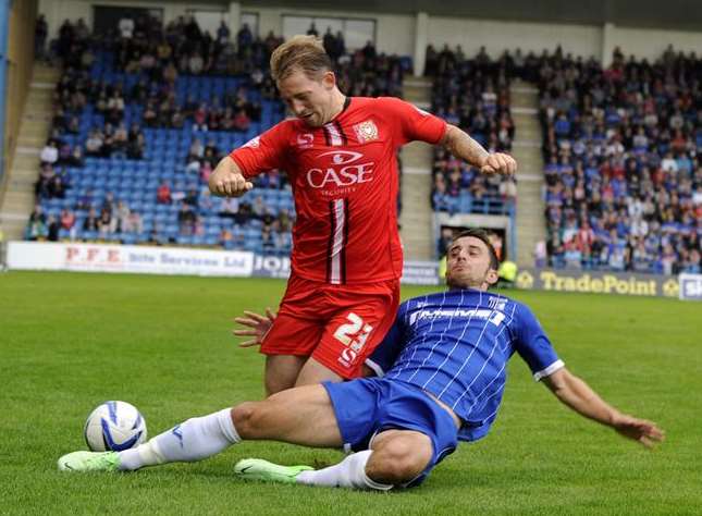 Chris Whelpdale slides in on MK Dons' Danny Green