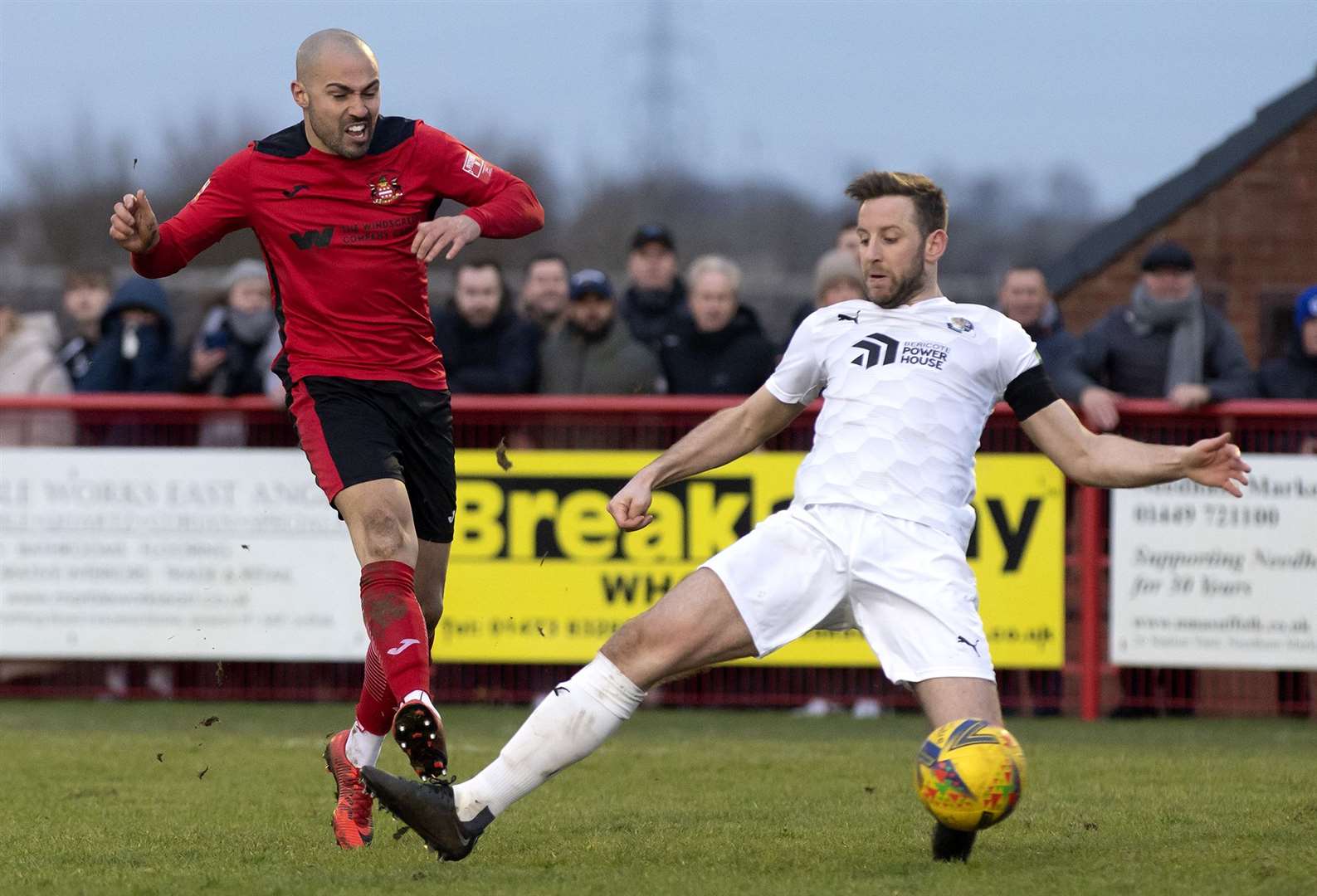 Dartford's Connor Essam tries to thwart Needham Market's Luke Ingram on Saturday. Picture: Mecha Morton