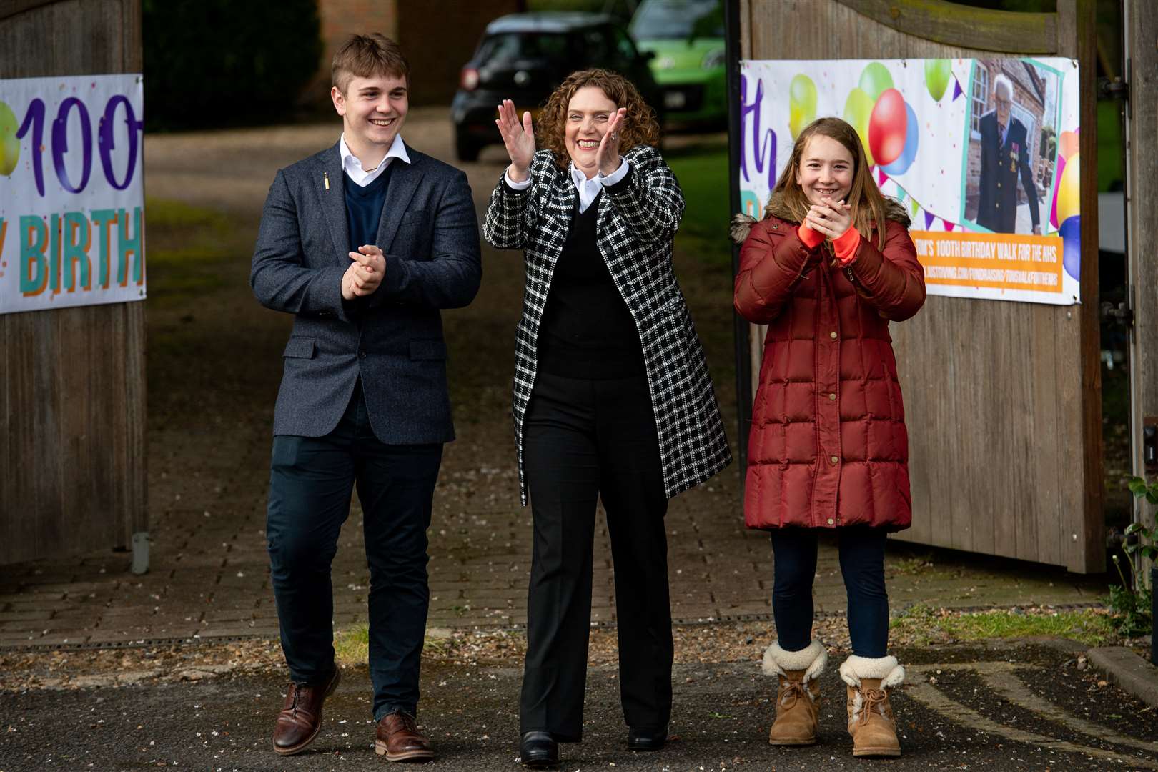 Hannah Ingram-Moore with Capt Tom’s grandchildren Benjie and Georgia Ingram-Moore (Jacob King/PA)