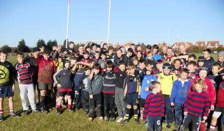 Andrew Foster, centre, with his wife, Donna, and Sheppey Rugby Club juniors at the sponsored run on Sunday