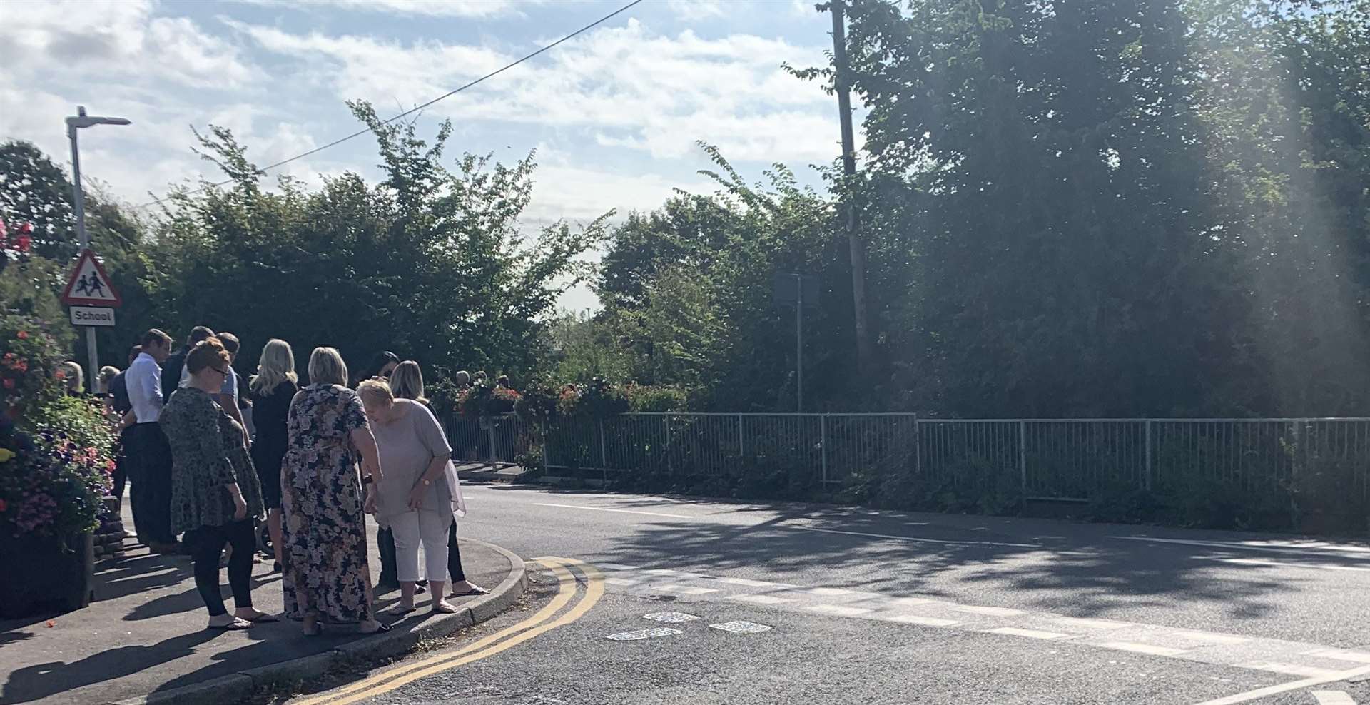 People line Tunstall Road for the funeral of Maisy Mayne