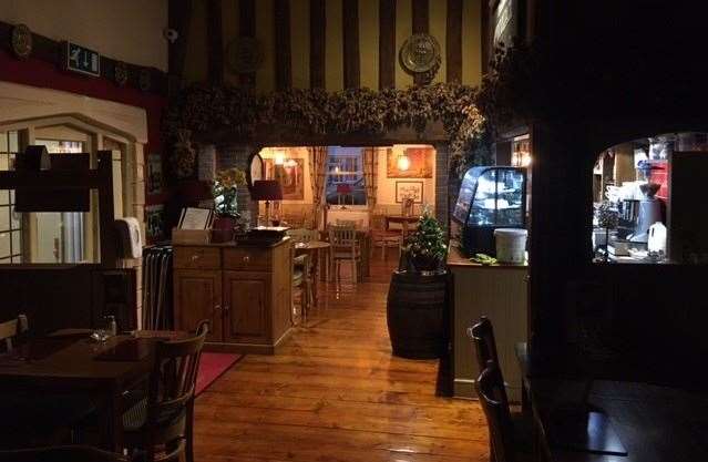 This is the view from the dining room at the back of the pub through to the bar at the front, note the carefully varnished floorboards throughout