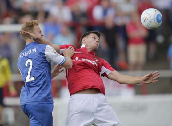 Charlie Sheringham battles with Adam Cash Picture: Martin Apps