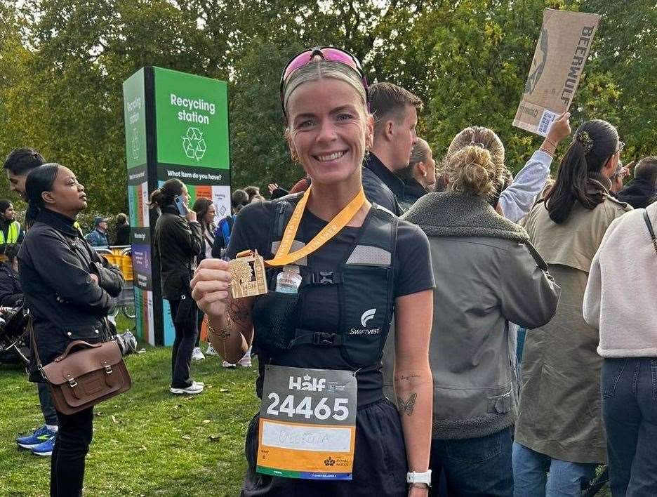 Georgia Culpitt with her medal after finishing the Royal Parks Half-Marathon in London.