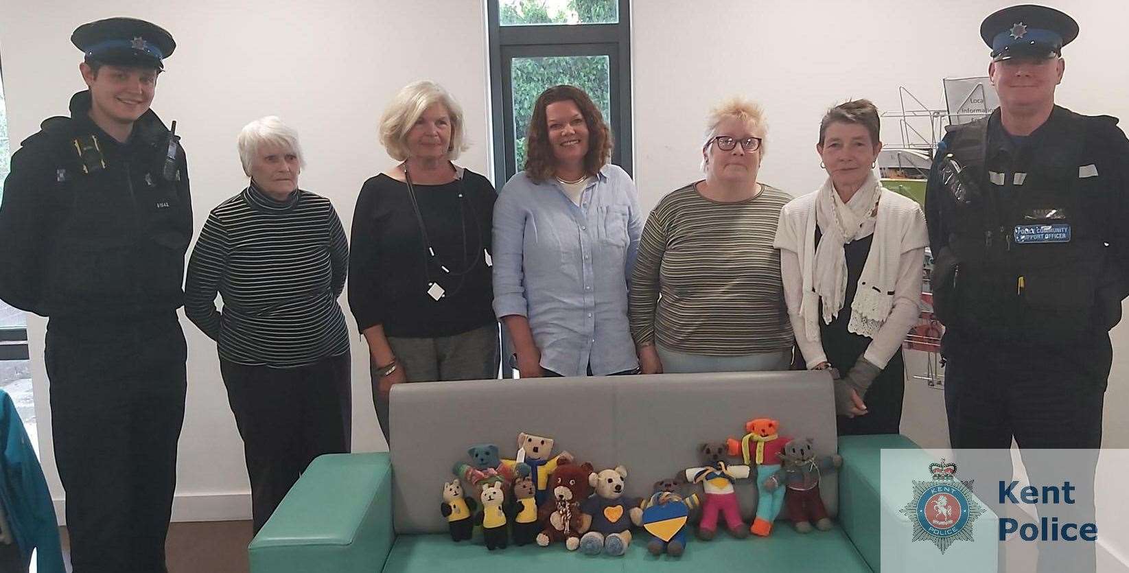 PCSO Callum Williams (left) and PCSO Adrian Butterworth (right) receiving some of the knitted bears from the Broadstairs Knitting and Crochet group. Picture: Kent Police