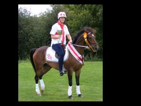 Kirsty Ferguson and Jack with the trophy they helped England win in Germany