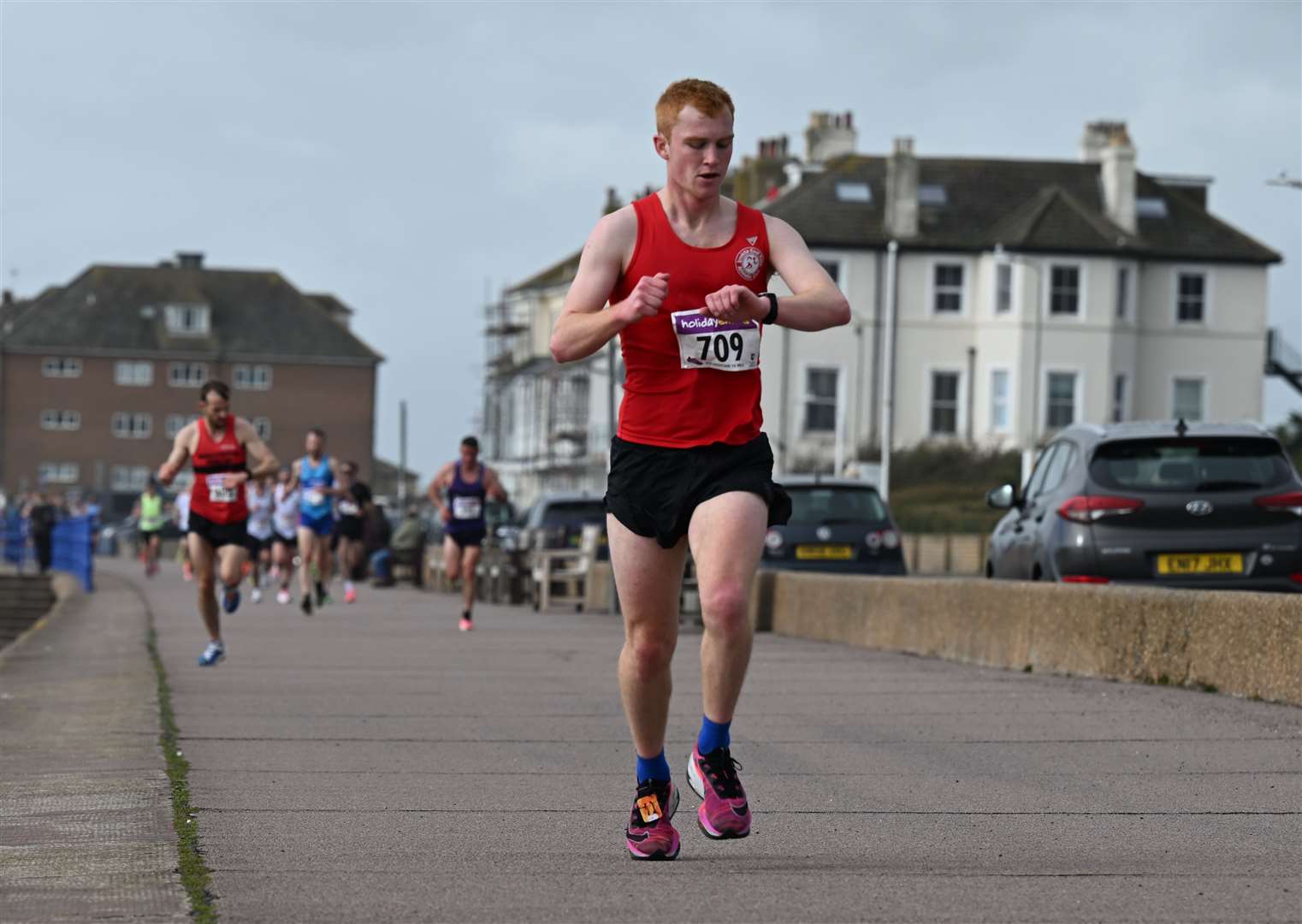 Tom Storer of Invicta East Kent keeps an eye on the time. Picture: Barry Goodwin