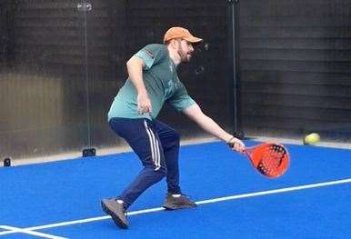 Reporter Ben Austin gets to grips with Padel as he sweeps a shot from low