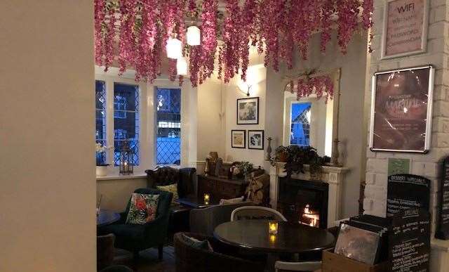 The Castle Hotel at High Street in Eynsford, near Dartford, decked out with hanging flowers