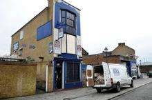 The damaged building in High Street, Blue Town