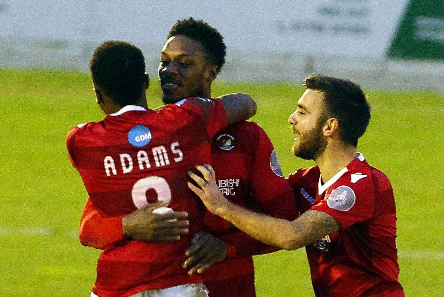 Bagasan Graham celebrates his goal with Ebou Adams and Jack Payne Picture: Sean Aidan