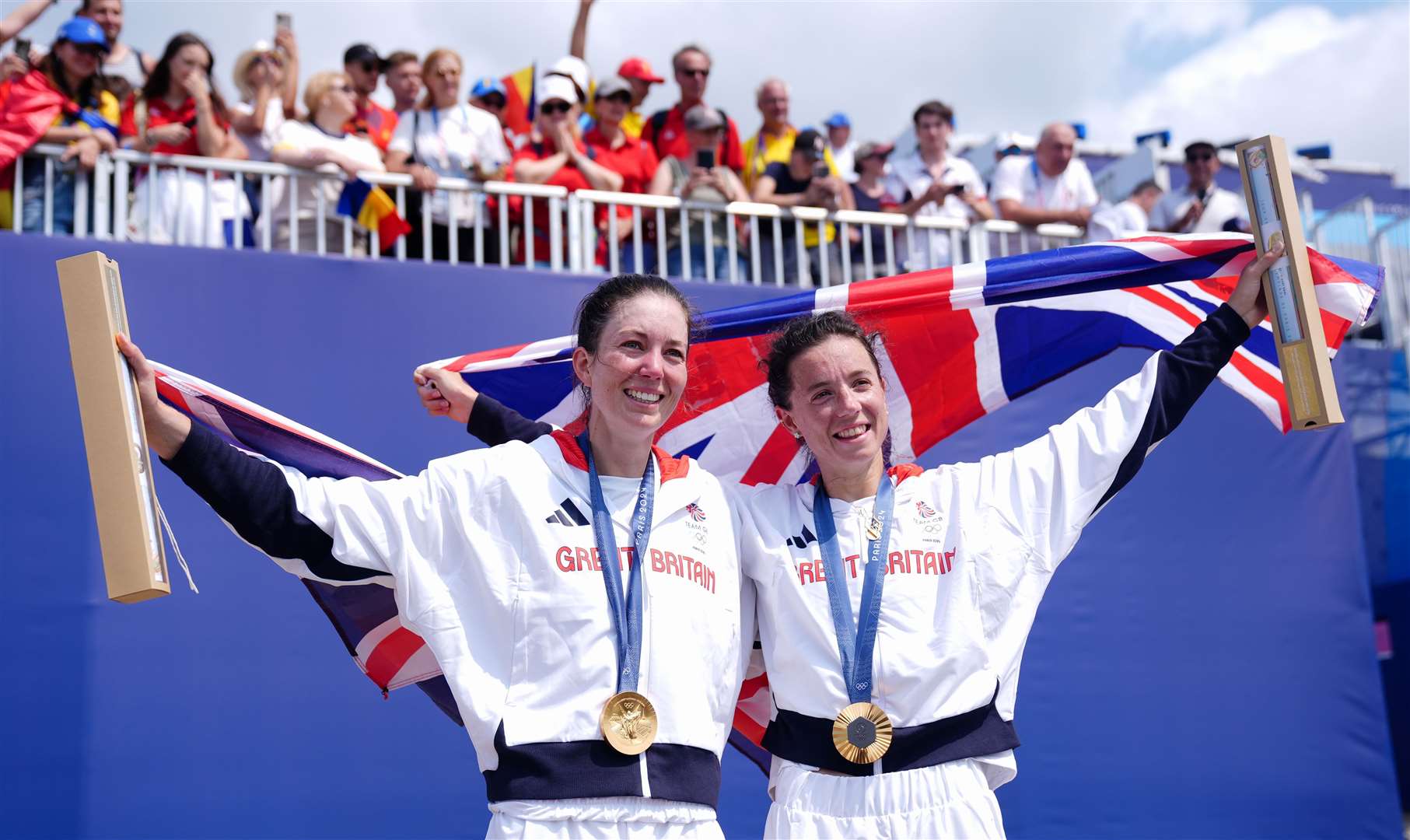 Great Britain's Emily Craig and Imogen Grant celebrate with their gold medals during the ceremony Picture: John Walton/PA Wire